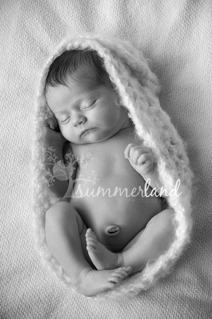 baby in knitted wrap Moses Lake newborn photography portrait session by Summerland Photography