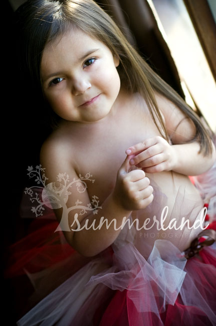little girl in Christmas tutu during Smmerland Photography child portrait session in Moses Lake