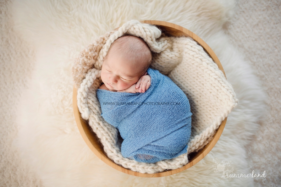 newborn baby pictures in Othello, Washington baby in wooden bowl