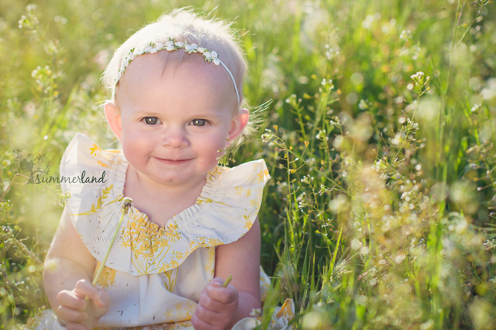 Moses Lake's best portrait photographer 1 year baby pics outdoor portrait in dandelions